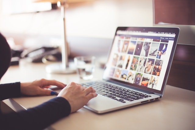 Woman on a laptop searching a business website